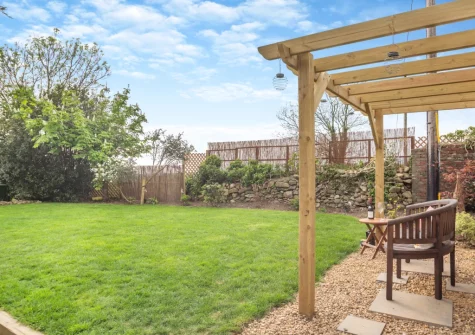 The outdoor sitting area & enclosed lawned garden at Talafon, Pencaenewydd