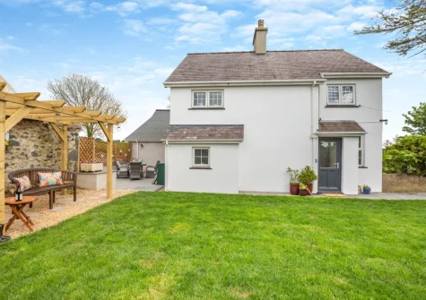 The outdoor sitting area & enclosed lawned garden at Talafon, Pencaenewydd
