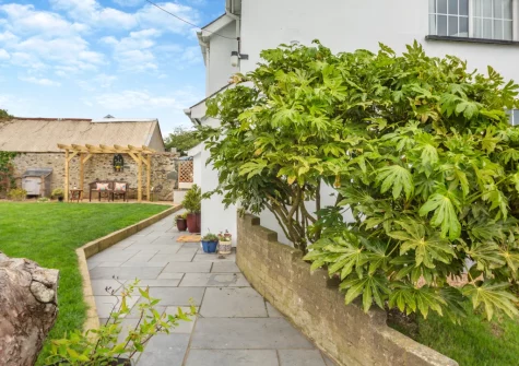 The outdoor sitting area & enclosed lawned garden at Talafon, Pencaenewydd