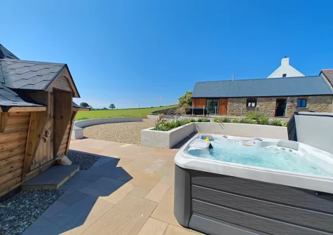 The patio, hot tub & enclosed barbecue hut at The Barn at Arnold's Hill Farm, Slebech