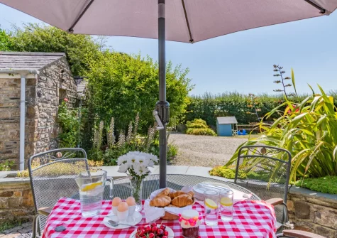 The patio, alfresco dining area & garden at The Barn, Haverfordwest