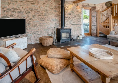 The Coastal Chapel, Rhodiad y Bren is a characterful cottage in peaceful countryside near St Davids, featuring original details, a cosy log burner, rural views towards Pembrokeshire's dramatic coast, and easy access to stunning Whitesands Bay.