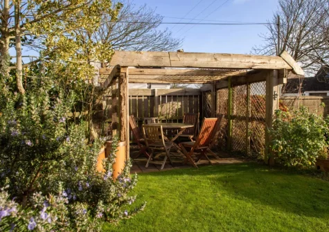 The alfresco dining & enclosed lawned garden at The Croft, LLanrhian