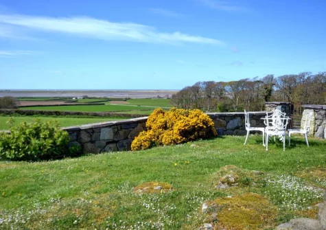 The lawned garden & alfresco dining area at The Granary, Llanfaglan
