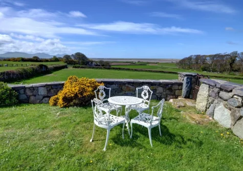 The lawned garden & alfresco dining area at The Granary, Llanfaglan