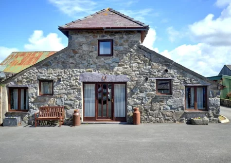 The With slate floors, stone walls & beamed sloping ceilings, The Granary is a former granary building set on a working farm at The Granary, Llanfaglan