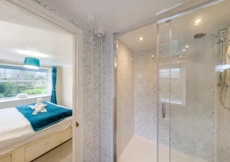 Bedroom #1 & en-suite shower room at The Granary, St Florence