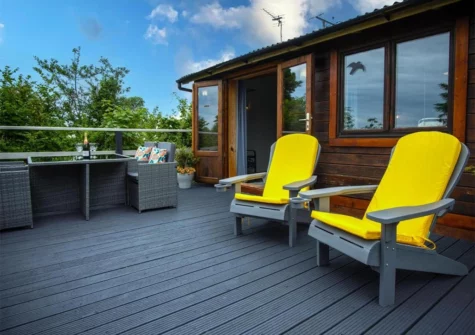 The decked patio & alfresco dining area at The Lodge At Sheepswalk Farm, Amroth