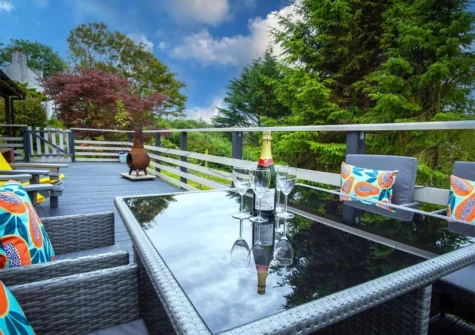The decked patio & alfresco dining area at The Lodge At Sheepswalk Farm, Amroth