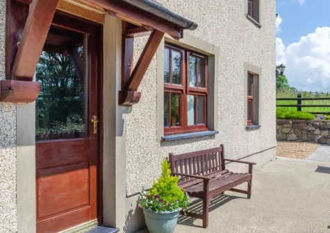 The Lodge is a characterful cottage with beamed ceilings & Welsh slate floors throughout