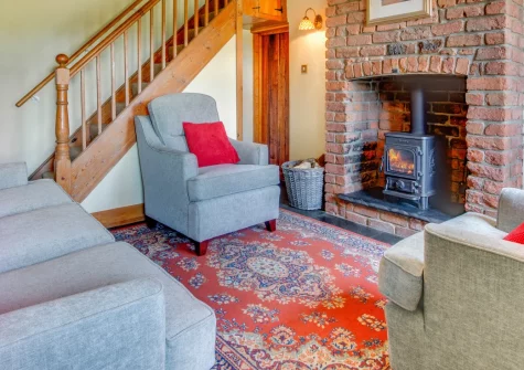 The Lodge, Llanfaglan is a characterful three-bedroom cottage on the edge of Caernarfon, boasting a lovely enclosed garden with far-reaching Snowdonia views, a cosy woodburning stove, and footpaths leading straight to Foryd Bay and beyond.