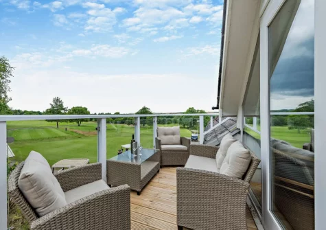 The balcony & outdoor sitting area at The Loft, Trefloyne Manor, Penally