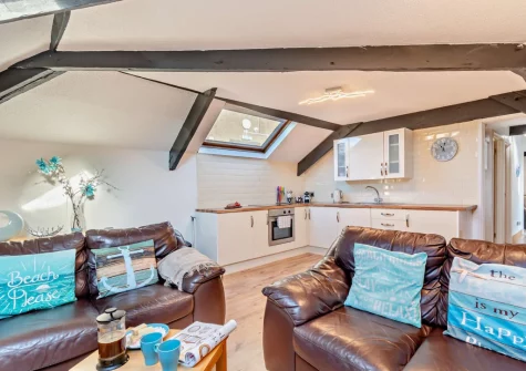 The living area & kitchen at The Mews, Tenby