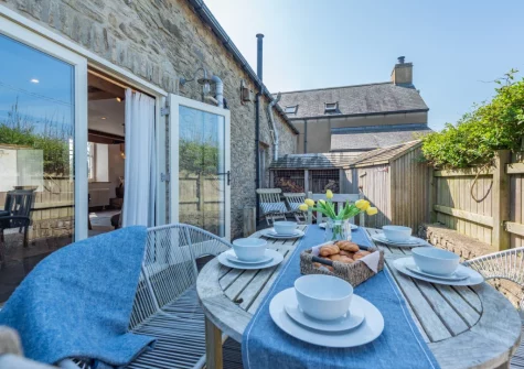 The enclosed decked terrace & alfresco dining area at The Old Chapel, Rhodiad y Bren