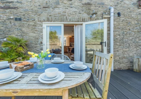 The enclosed decked terrace & alfresco dining area at The Old Chapel, Rhodiad y Bren