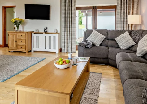 The Old School Hall, Loveston is a spacious family retreat in a beautifully converted schoolhouse, featuring four bedrooms, peaceful countryside views from a private balcony, shared play facilities, and easy access to Pembrokeshire's beaches.