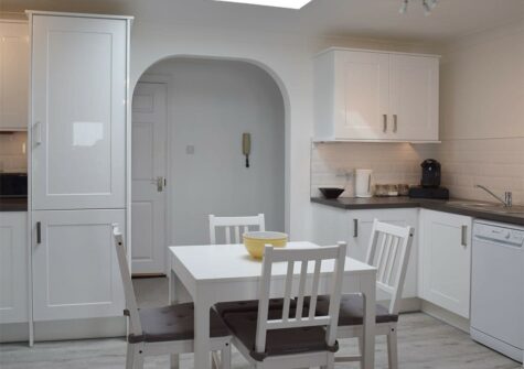The dining area at The Penthouse at Newton Croft, Tenby