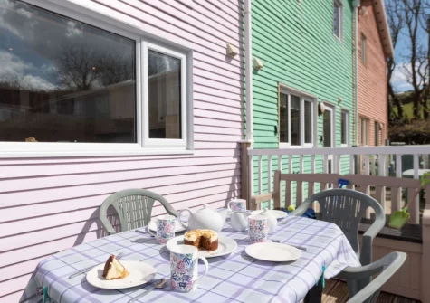 The rear verandah & alfresco dining area at Tickled Pink at 14 Freshwater Bay, Freshwater East