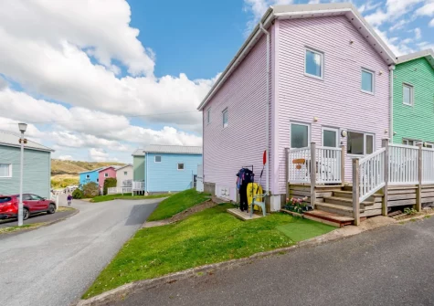 Tickled Pink is set within a collection of vibrantly coloured holiday homes less than 300 metres from the beach