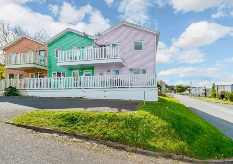 Tickled Pink is set within a collection of vibrantly coloured holiday homes less than 300 metres from the beach