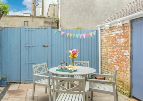 The enclosed rear garden & alfresco dining area at Tideway, Tenby