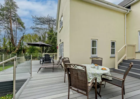 The decked patio & alfresco dining area at Twmbarlwm, Tenby