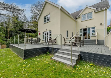The decked patio, alfresco dining area & garden at Twmbarlwm, Tenby