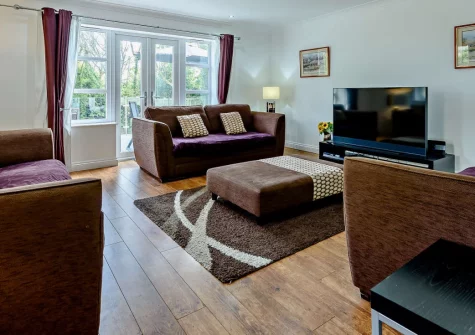Twmbarlwm, Tenby is a spacious four-bedroom house on an exclusive road near this beloved coastal town, featuring a large garden with composite decking and glass balustrades, contemporary interiors, and access to Tenby's beaches and walled centre.