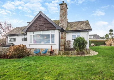 The small patio, outdoor sitting area & lawned garden at Ty Adda, Abersoch