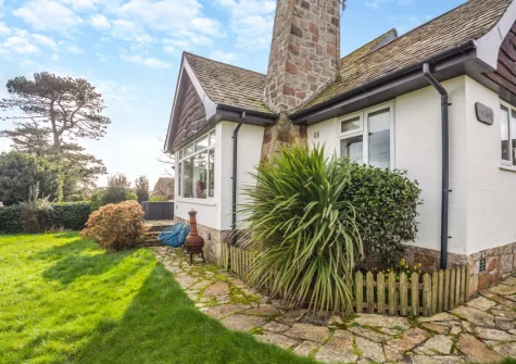 The small patio, outdoor sitting area & lawned garden at Ty Adda, Abersoch