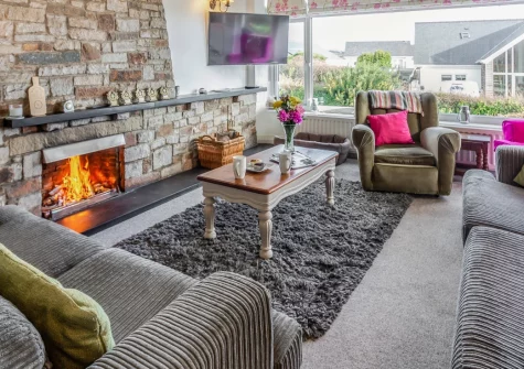 Ty Adda, Abersoch is a charming three-bedroom house just half a mile from the village, boasting panoramic Cardigan Bay views, a dedicated teen games room, a patio garden with BBQ, and easy access to Abersoch's sandy beaches, pubs, and boutique shops.