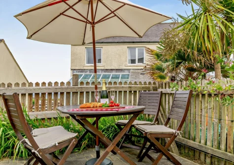 The enclosed rear garden, patio & alfresco dining area at Ty Del, Broad Haven