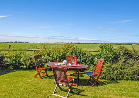 The garden & alfresco dining area at Ty Fferm, Croesgoch