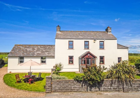 Ty Fferm is a traditional Welsh Farmhouse set on a quiet country lane leading towards the coast, facing traditional farm buildings & surrounded by open fields
