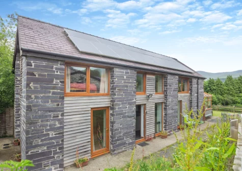 Ty Gwair is a wonderful three-bedroom barn conversion in the heart of Eryri (Snowdonia National Park)