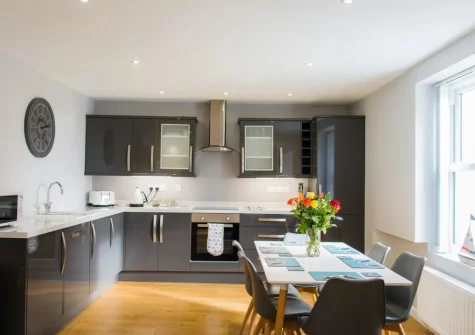 The kitchen & dining area at Ty Haf, 4 Dunmore Apartments, Tenby