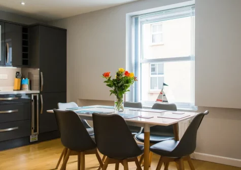 The kitchen & dining area at Ty Haf, 4 Dunmore Apartments, Tenby