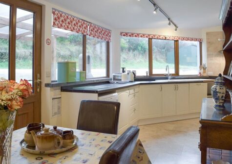 The dining area & kitchen at Ty Hapus, Dwrbach