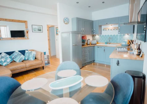 The open-plan living & dining area and kitchen at Ty Mabli, Tenby