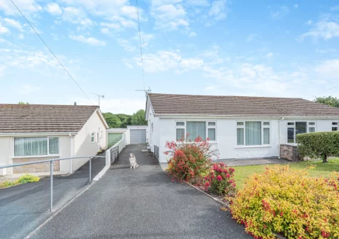 Enjoy Ty Merlyn's spacious front & rear gardens laid to lawn with two patio areas