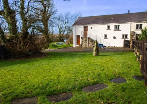 The alfresco dining area & south facing garden at Ty Moch Bach, Castlemorris