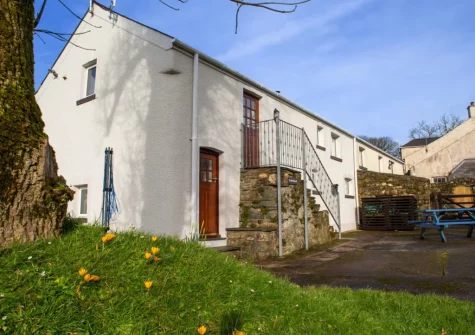 The alfresco dining area & south facing garden at Ty Moch Bach, Castlemorris