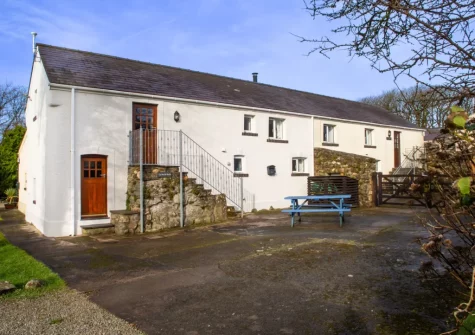 Ty Moch Bach is a beautifully converted 18th-century barn that's full of charm, with exposed beams, vaulted ceilings, and original slate and stone features