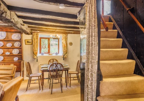 The dining area & stairs up to the first floor at Ty'n Lon Isaf, Bontddu