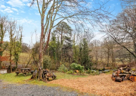 The lower garden & alfresco dining area at Ty'n Lon Isaf, Bontddu