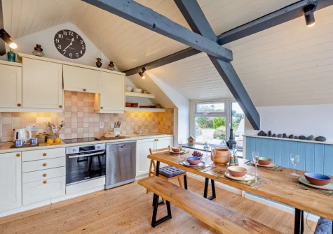 The kitchen & dining area at Ty'n Y Mur Cottage, Abersoch