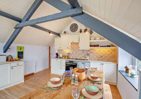 The kitchen & dining area at Ty'n Y Mur Cottage, Abersoch