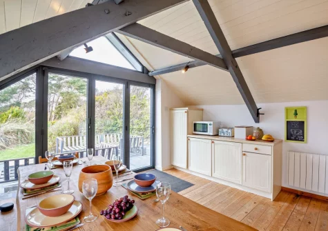 The kitchen & dining area at Ty'n Y Mur Cottage, Abersoch