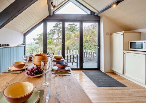 The kitchen & dining area at Ty'n Y Mur Cottage, Abersoch