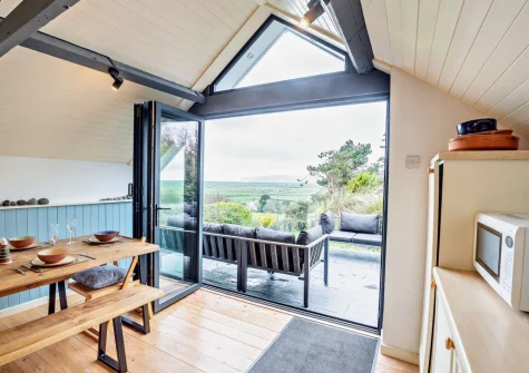 The kitchen & dining area at Ty'n Y Mur Cottage, Abersoch